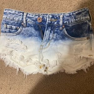Ripped blue jean shorts